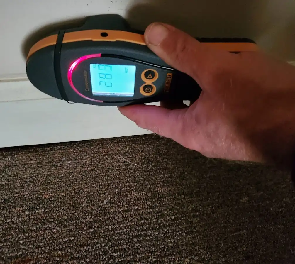 Moisture detection at baseboard during Storm Damage Restoration in Miles City